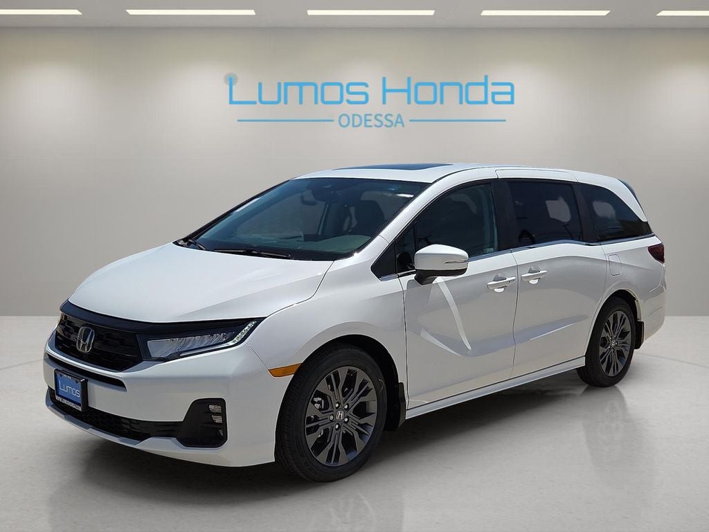 2026 Honda Odyssey Touring in Platinum White Pearl — front three-quarter view